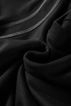 Black blouse with contrast stitching detail and puff sleeves