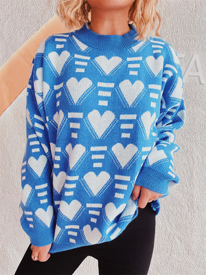 Blue acrylic knit jumper with white geometric heart pattern and mock neck.