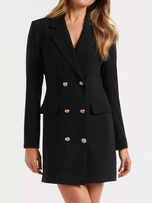 Black tailored double-breasted blazer dress with gold buttons and flap pockets.