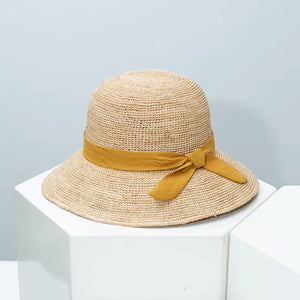 Chic wheat straw sun hat with yellow bow detail