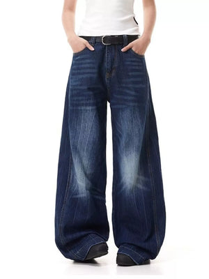 Belted wide leg jeans in washed denim with vertical stripe detail.