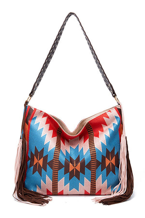 Southwestern hobo bag with multicolor geometric pattern, fringe details, and a canvas material.