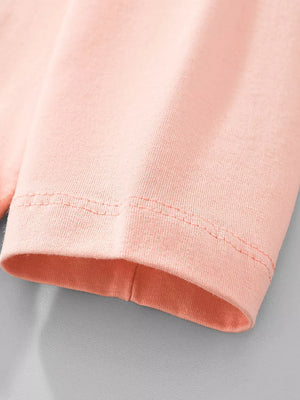 Peach long sleeve baby t-shirt, cotton crew neck, close-up on hem detail