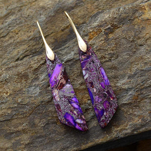 Purple gold dangle earrings with marbled stone and gold accents.