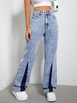 Light acid wash bootcut jeans with split hems and dark denim insets.