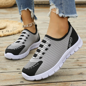 Mesh slip-on sneakers in grey and black with white accents and "Sports" detail.