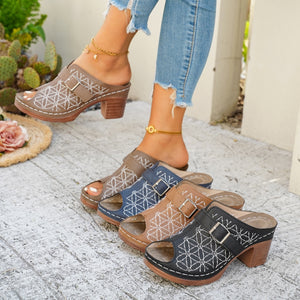 Chic buckle-embellished mid heel sandals in khaki, blue, tan, and black with white geometric embroidery.