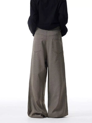 Men's wide-leg sweatpants in brown check with back pockets and a comfortable drape.