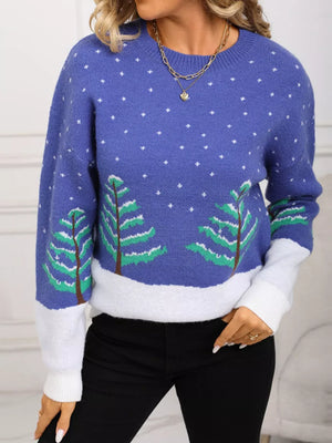 Blue acrylic knit sweater with white snow and evergreen tree pattern, crew neck, color block sleeves.