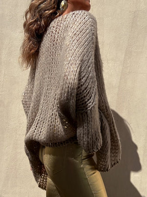 Camel open knit sweater with asymmetric hem and beaded trim detail.