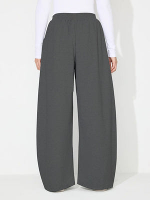 Dark gray pleated drape palazzo trousers with a comfortable elastic waistband.