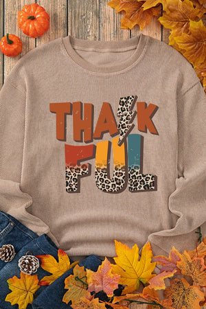 Textured ribbed camel sweatshirt with "Thankful" graphic featuring leopard print and lightning bolt details.