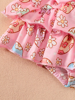 Pink ruffled bodysuit and skirt set with a floral print and bow detail.