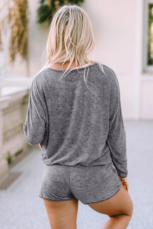Gray textured lounge set with long sleeves and shorts, showing the back view.