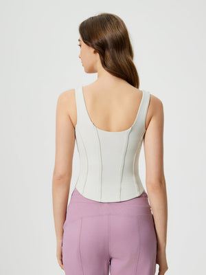 Light blue sculpted seam tank top with built-in support and curved hem.