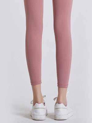 FlexFit 7/8 leggings in Dusty Pink with a wide waistband, paired with white sneakers.