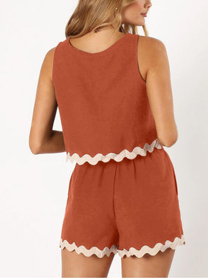 Orange-Red outfit set with scalloped trim detail on crop top and shorts.
