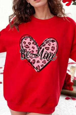 Red crewneck sweatshirt with a pink leopard print heart graphic that says "Be Mine".