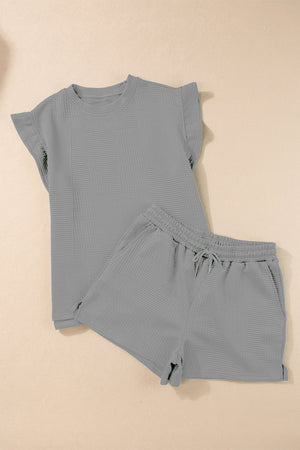 Gray textured loungewear set with flutter sleeve top and drawstring shorts