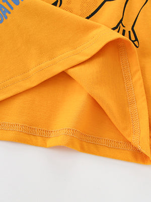 Orange toddler t-shirt with alligator graphic and blue text, showing hem detail.