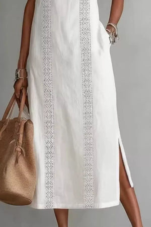 White midi dress with lace trim and pockets, side slits