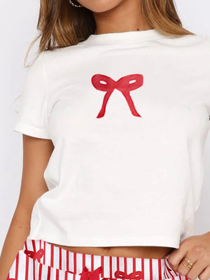 White short sleeve tee with red bow graphic and striped lounge shorts.