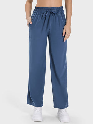 Relaxed drape drawstring palazzo pants in Dusty Blue with side pockets and elastic waistband.