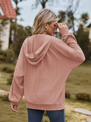 Pale Blush textured knit dolman sleeve hoodie with a relaxed fit.