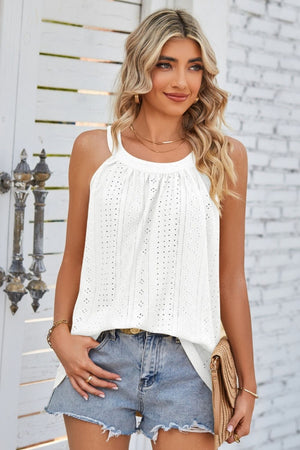 White eyelet halter tank top with a relaxed fit, styled with denim shorts.