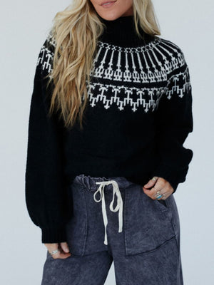 Black acrylic turtleneck sweater with white Fair Isle pattern and puff sleeves.