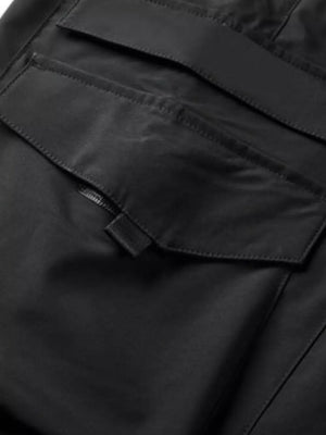 Black cargo pants with flap pockets and drawstring detail