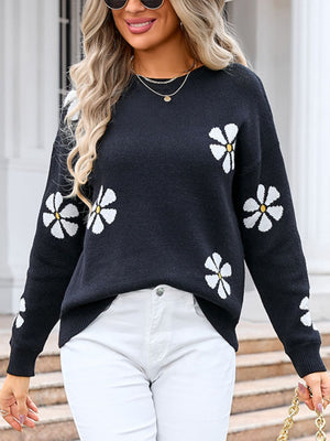 Black acrylic knit sweater with white daisy intarsia pattern, crew neck, long sleeves.