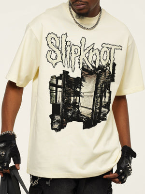 Men's pastel yellow distressed graphic t-shirt with crew neck and short sleeves.