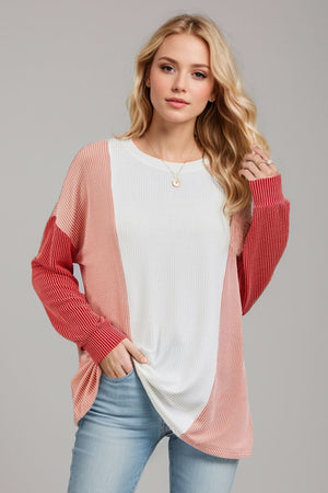 Colorblock waffle knit pullover sweater with white, coral, and red panels.