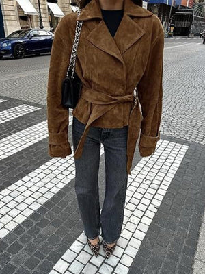 Brown faux suede bolero jacket with tie waist and lapel collar.