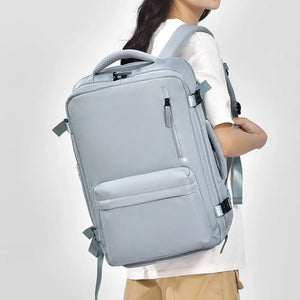 Light blue tech backpack with multiple compartments and padded straps.