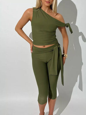 Olive green one-shoulder tie-knot top with matching capri leggings and sash detail.