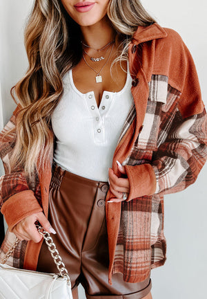 Colorblock plaid shacket in terracotta with contrast cuffs and button front.