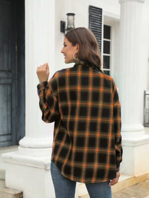 Plaid shirt in brown and orange with button front and collar, shown from the back.