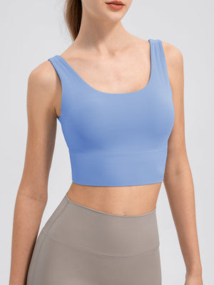 Light blue performance crop top with scoop neck and wide band.