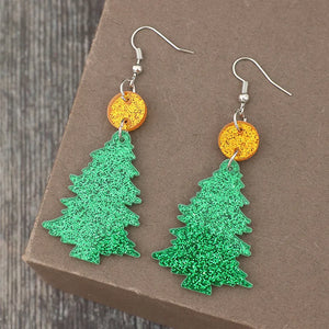 Glittering green acrylic Christmas tree drop earrings with orange glitter discs.