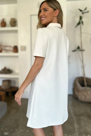 Ivory textured V-neck short sleeve mini dress with geometric pattern