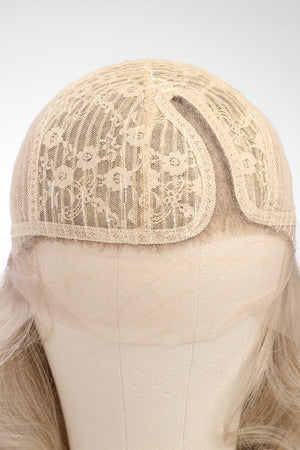 Blonde lace front wig cap with detailed floral lace overlay and mesh construction.
