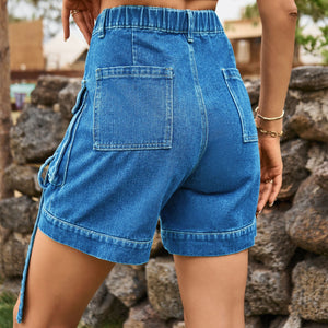 Denim cargo shorts in blue with utility pockets and belt detail.