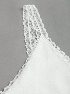 White lace trim camisole with delicate lace straps and neckline detail.