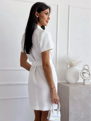 White tailored blazer dress with chic belt and short sleeves, buttoned front.