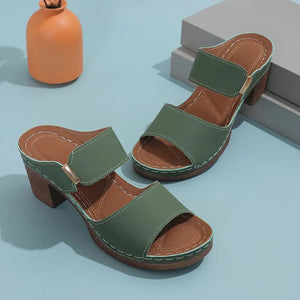 Dark Green leather platform mules with block heel and adjustable strap.