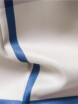Men's blue and white striped cotton button-up shirt detail