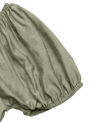 Sage green smocked waist maxi dress detail with textured fabric and elasticated hem.