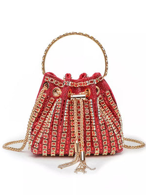 Red rhinestone-embellished bucket crossbody bag with gold chain and handle.